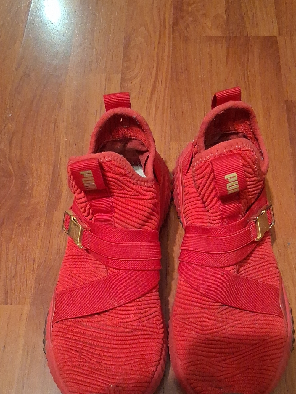 Puma  Ladys  Red Slip-On Sneakers with Gold Accents